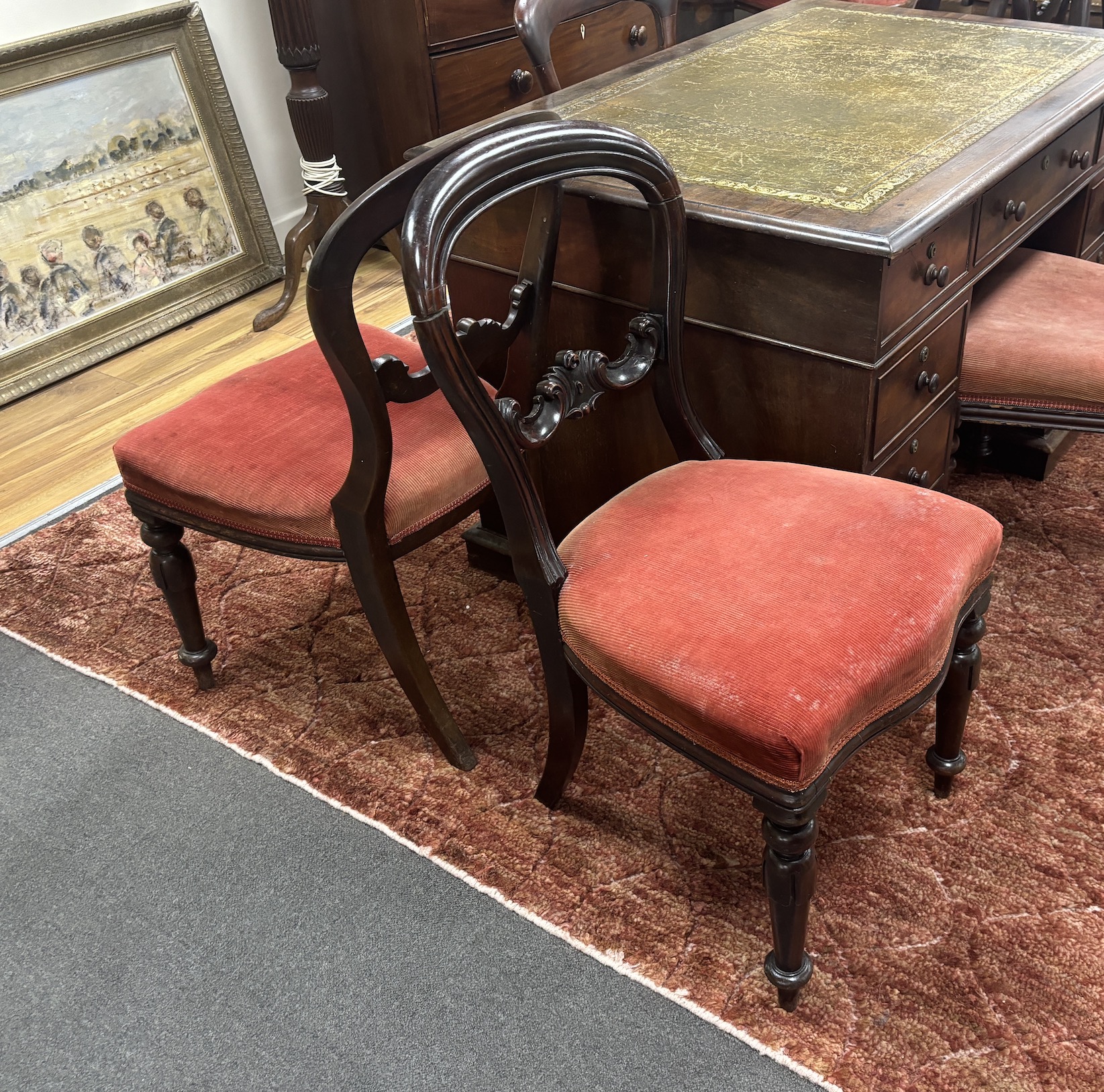 A set of six Victorian balloon back dining chairs